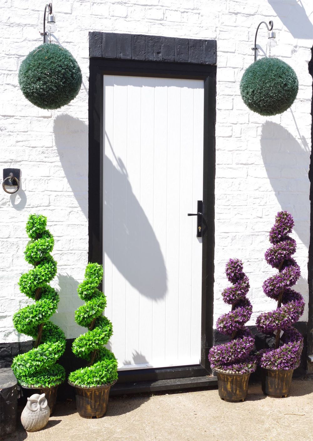 120cm Pair of Green Large Leaf Spiral Topiary Trees with Decorative Planters for Outdoor Charm